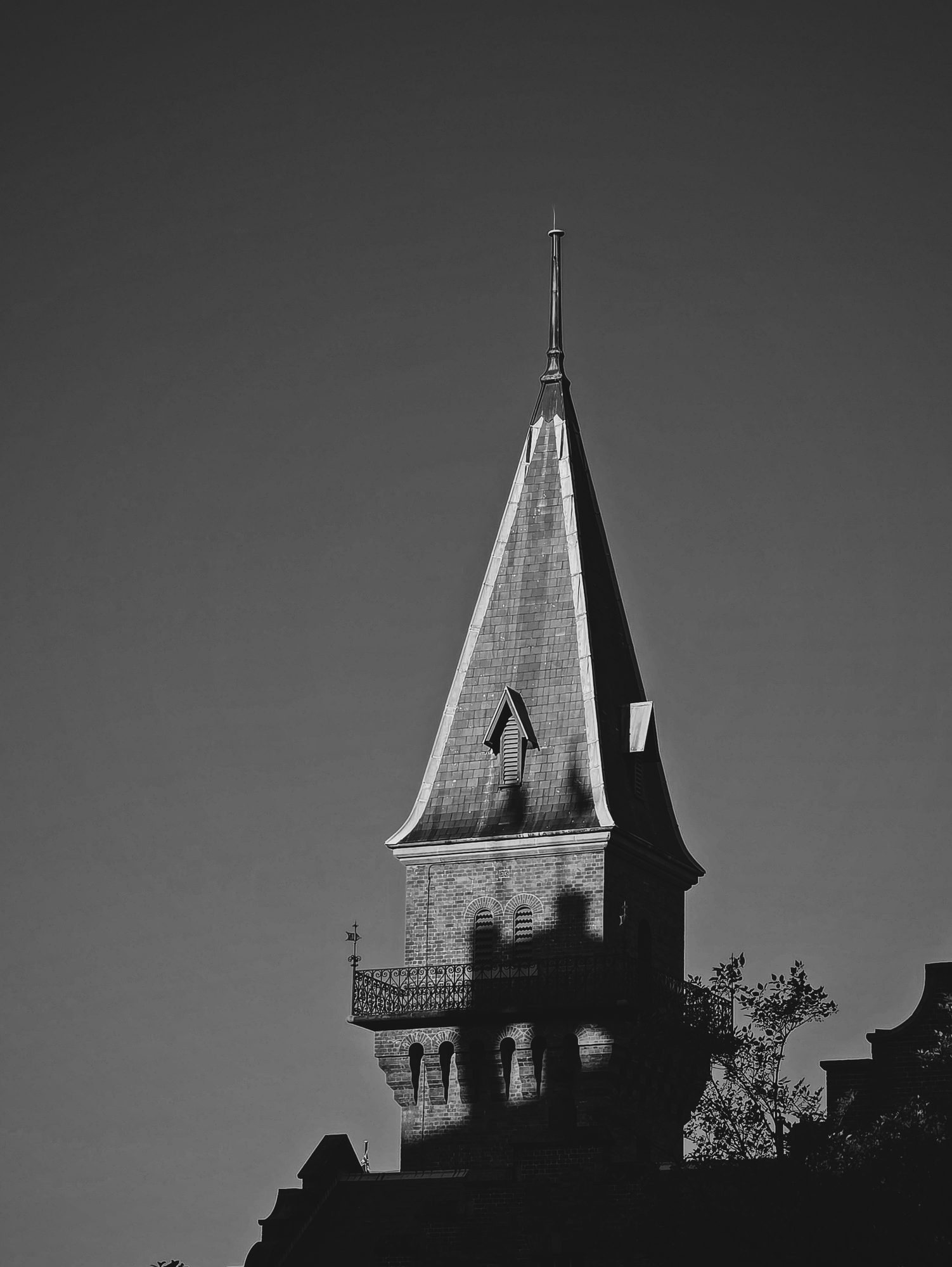 Spire, late shadow, sandstone the colour of dust.