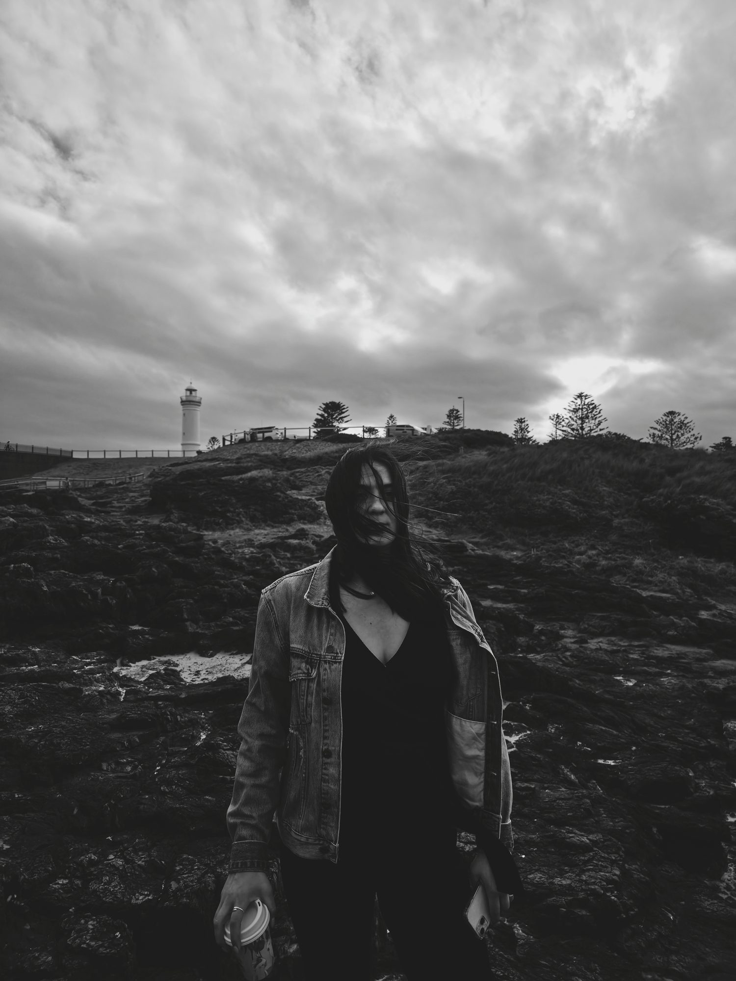 The wind, the lighthouse, her not looking at the camera.